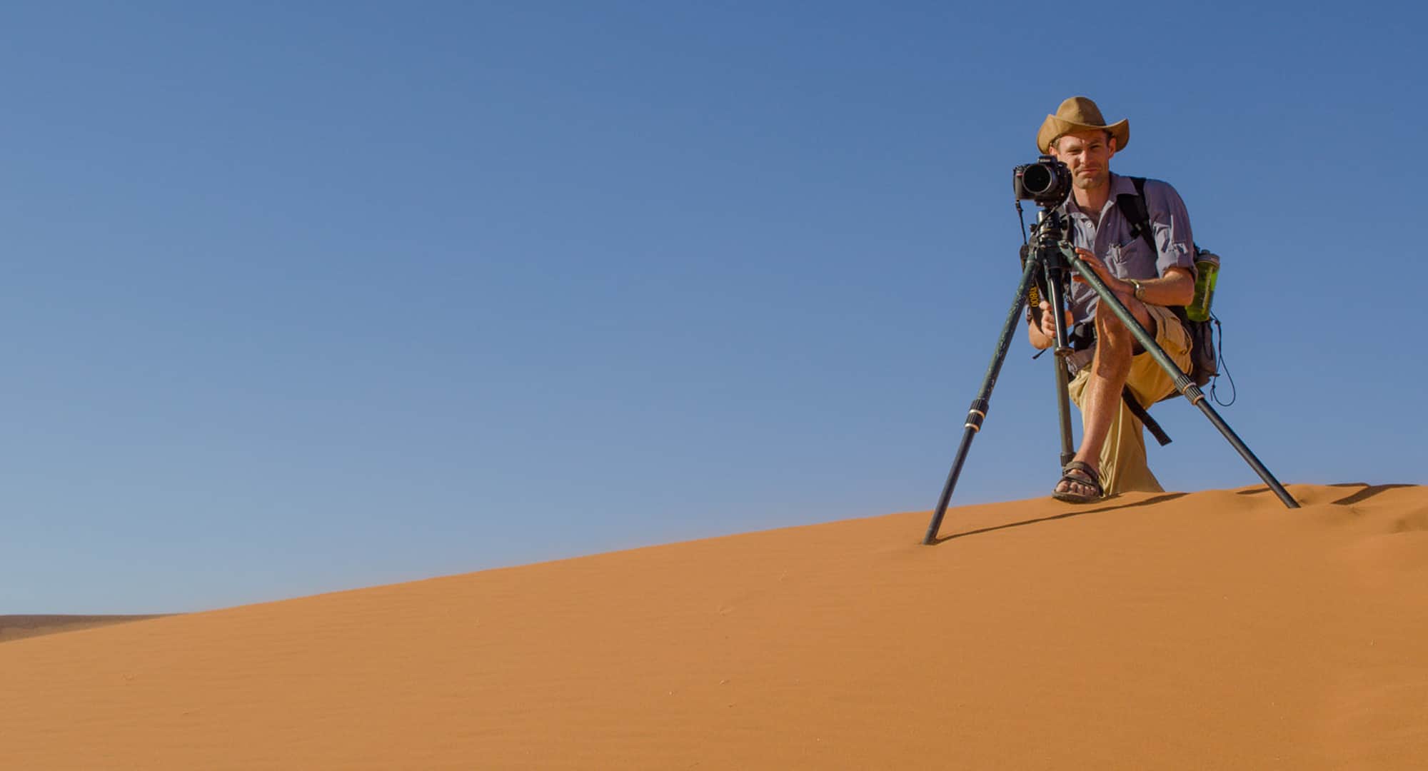 Photographer on a dune in Namibia