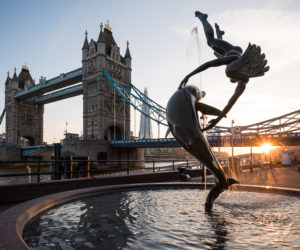 Fountain of a girl and dolphin at sunset, Tower Bridge, London, England