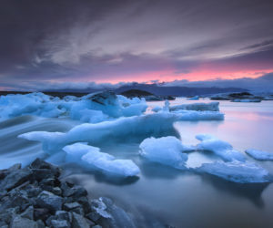 Icebergs floating in Jokulsarlon glacier lake at sunset.South Iceland.