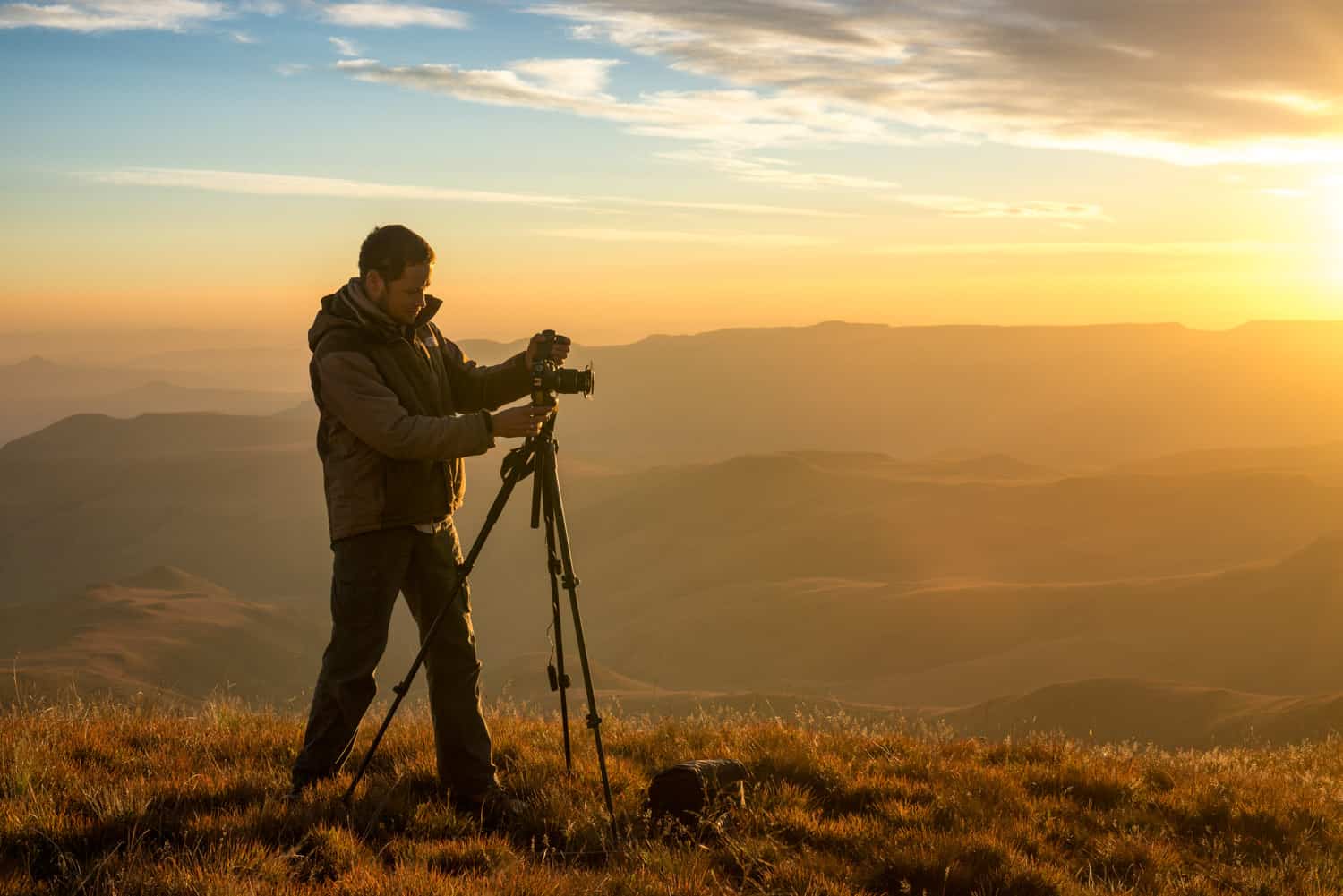 Photographer taking photos of the sunset