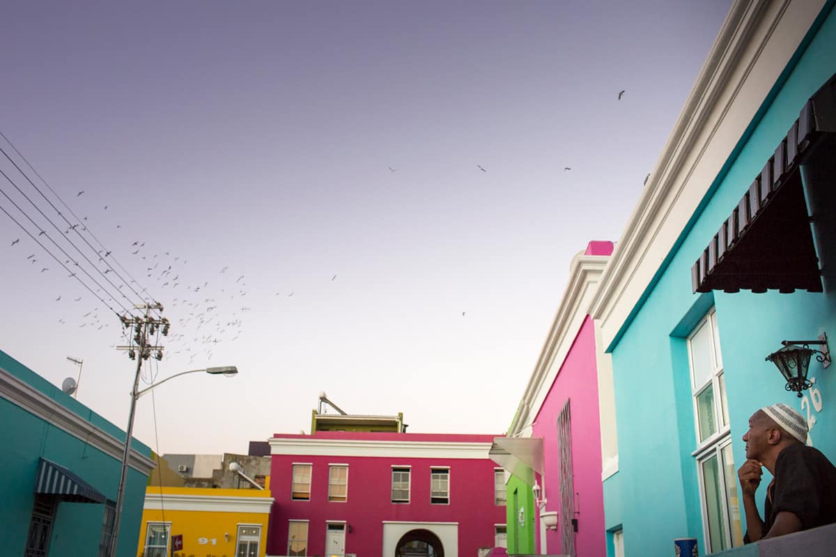 A view of the sky, framed by the colourful houses of Bo-Kaap by Sarah Isaacs