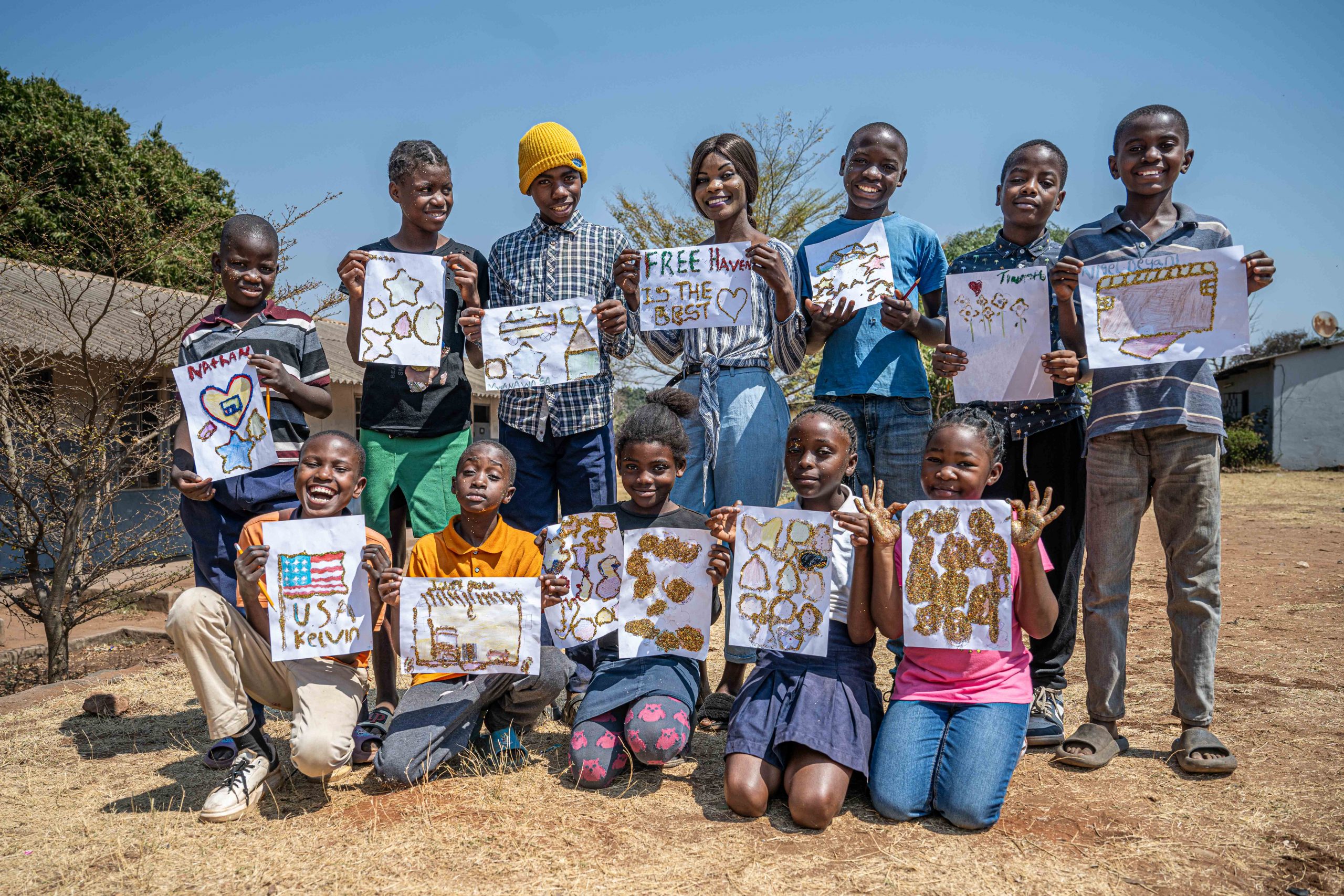 local children showing their artwork