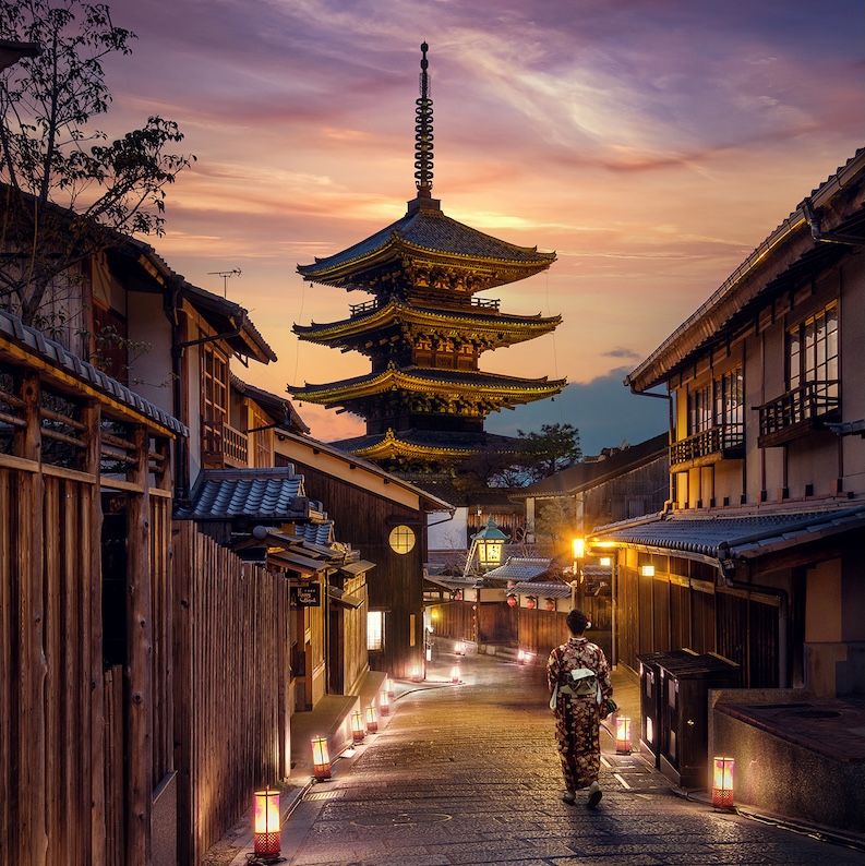 A street in Japan at nighttime.